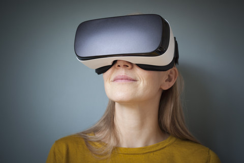 Woman wearing Virtual Reality Glasses stock photo