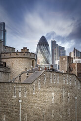 UK, London, view to Swiss Re Tower and other modern buildings with Tower of London in the foreground - NKF000436