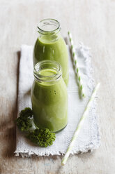 Two glass bottles of kale smoothie - EVGF002782