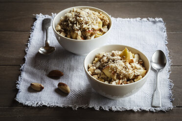 Two bowls of vegan quinoa porridge with apple and pecan - EVGF002786