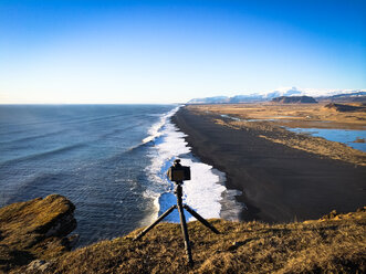 Iceland, Dyrholaey, Camera on tripod at beach - STCF000139