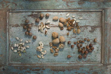 Different sorts of nuts on wood - ASF005822
