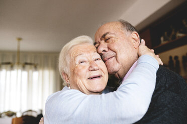Affectionate senior couple hugging at home - GEMF000672