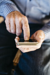 Hands of senior man using smartphone - JRFF000381