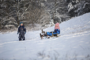 Two children tobogganing - ASCF000475