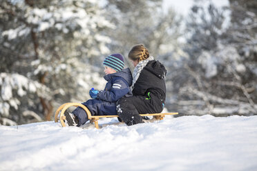 Two children sitting on a sledge - ASCF000478