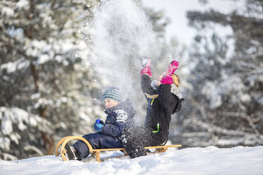 Two children sitting on a sledge - ASCF000479