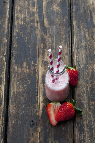 Glass bottle of strawberry smoothie stock photo