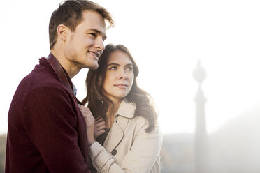 Germany, Berlin, smiling young couple looking around - GCF000147