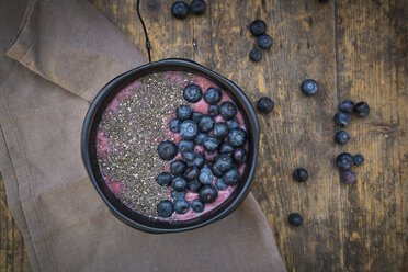 Blueberry smoothie with chia seeds in bowl, fresh blueberries - LVF004501