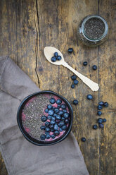Blueberry smoothie with chia seeds in bowl, fresh blueberries - LVF004502