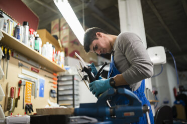 Mechanic repairing a drone in his workshop - RAEF000832