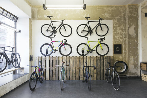 Assortment of racing cycles in a custom-made bicycle store - JUBF000101