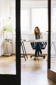 Young woman working at home office - AKNF000038