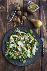 Lamb's lettuce with pear, gorgonzola and walnut on plate, fork - SARF002534