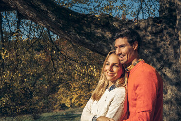 Happy couple enjoying autumn forest - CHAF001567