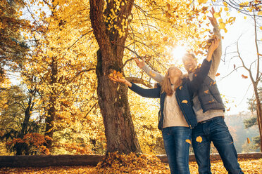 Happy couple having fun in autumn in a forest - CHAF001586