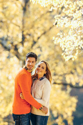 Happy couple enjoying autumn in a forest - CHAF001605