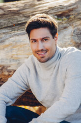 Portrait of smiling young man outdoors - CHAF001622