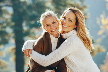 Portrait of happy mother and adult daughter in autumn - CHAF001646