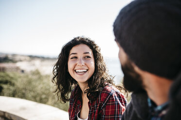 Happy young woman looking at boyfriend outdoors - JRFF000401