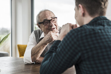 Portrait of happy senior man communicating with his grandson - UUF006579