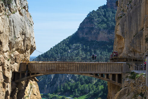 Spain, Ardales, The King's Little Pathway, tourists standing on skywalk looking at view - KIJF000166