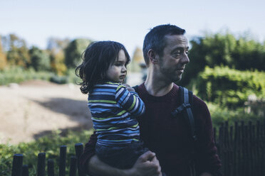 Father holding his son outdoors - BOYF000095