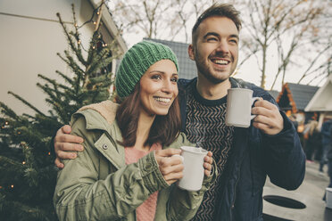 Couple having a hot punch on the Christmas Market - MFF002673