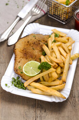 Veal escalope, breaded veal, and french fries on plate - ODF001377