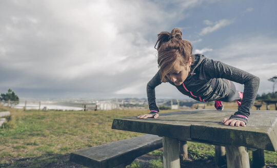 Mid adult woman doing outdoor workout - DAPF000047