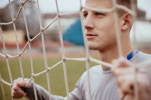 Young man in soccer goal - ZEDF000055