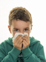 Portrait of boy blowing his nose - EJWF000776