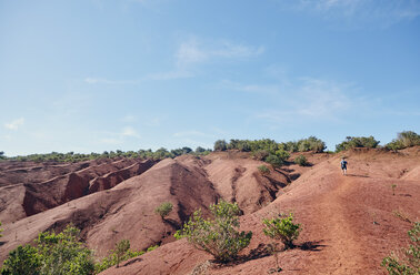 Spain, Canary Islands, La Gomera, hiker in barren landscape - RHF001286