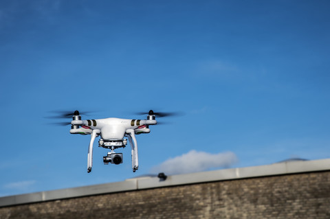 Flying drone with camera stock photo