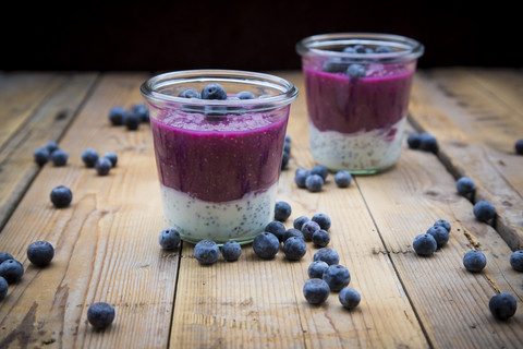 Two glasses of chia blueberry pudding stock photo