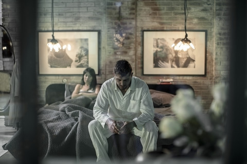 Couple in bedroom having an argument stock photo