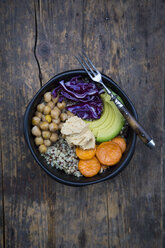 Bowl of quinoa, avocado, roasted chick-peas, sweet potato, red cabbage and hummus - LVF004534