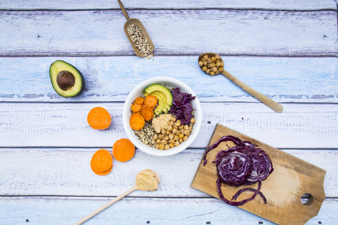 Bowl of quinoa, avocado, roasted chick-peas, sweet potato, red cabbage and hummus - LVF004541