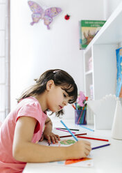 Little girl drawing on his desk at home - MGOF001456