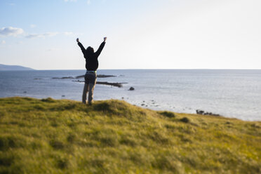 Ireland, Man enjoying the wind in Connemara - GIOF000769