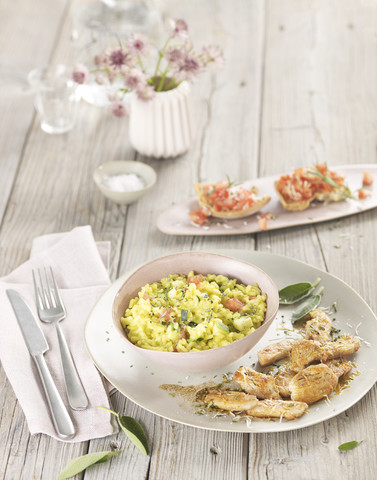 Saffron risotto with chicken and bruschetta stock photo