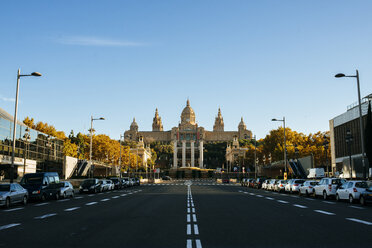 Spain, Barcelona, empty Avenue Reina Maria Cristina with National Palace in the background - KIJF000175