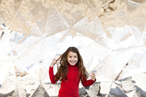 Portrait of smiling little girl in front of metal wall - VABF000219