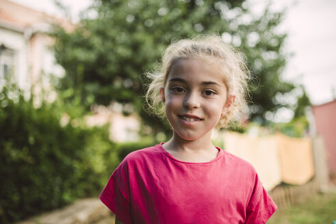 Portrait of smiling blond girl - RAEF000906