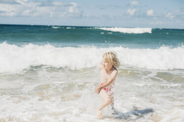 France, Brittany, Cap Frehel, Cote d'Emeraude, boy playing in water - MJF001820