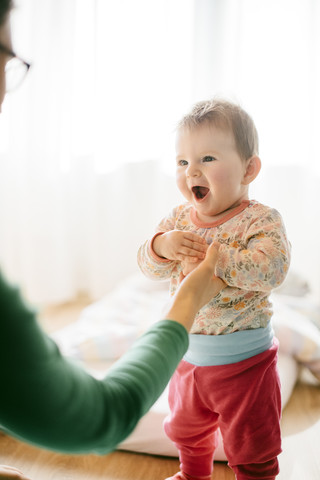 Portrait of baby girl on her mother's hand stock photo