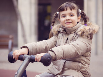 Portrait of smiling little girl with braids on a playground - XCF000062