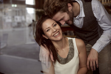 Happy young couple in a cafe - SUF000065