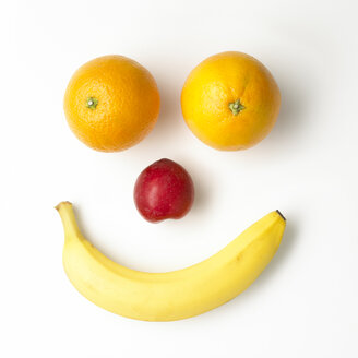 Smiley face built of fruits on white ground - SRSF000607